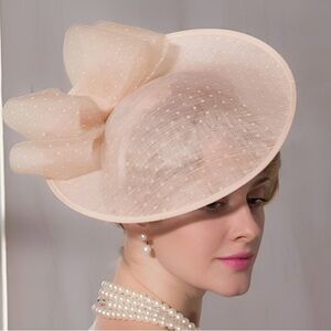 Elegant peach cream fascinator with bow